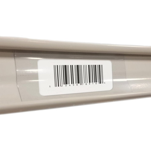 Gondola Shelving Insert Strip with a UPC label on an ivory gondola shelf. Gondola Shelving Insert Strip with a UPC label on an ivory gondola shelf.