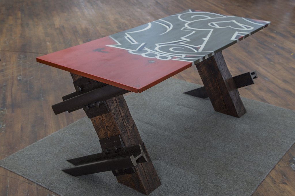 red white and black graffiti style table with cantilevered legs