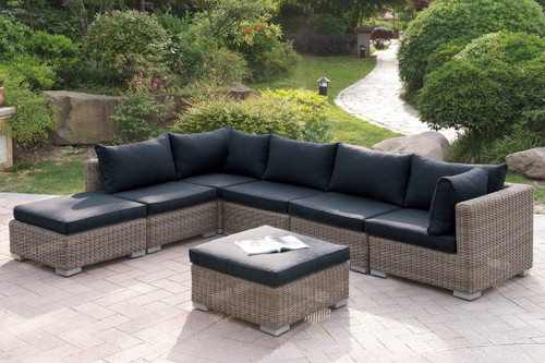 7PC OUTDOOR PATIO SOFA SET IN TAN RESIN WICKER FINISH WITH OTTOMAN AND BLACK SEAT CUSHIONS