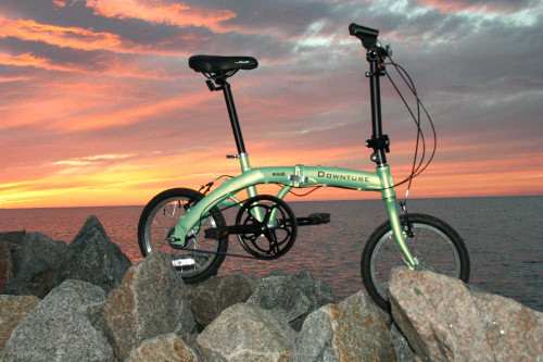 mini folding bike standing waterfront