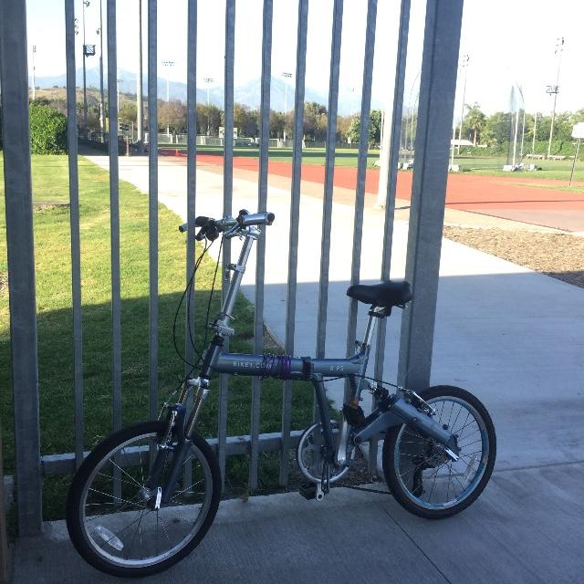 8FS silver folding bike on campus