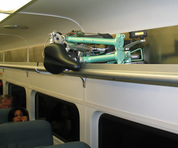 mini-folding-bike-overhead-bin-njt-train.jpg