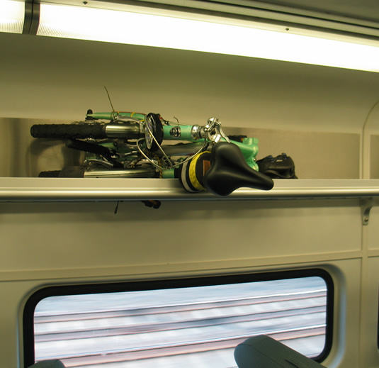 mini-folding-bike-overhead-bin-train.jpg