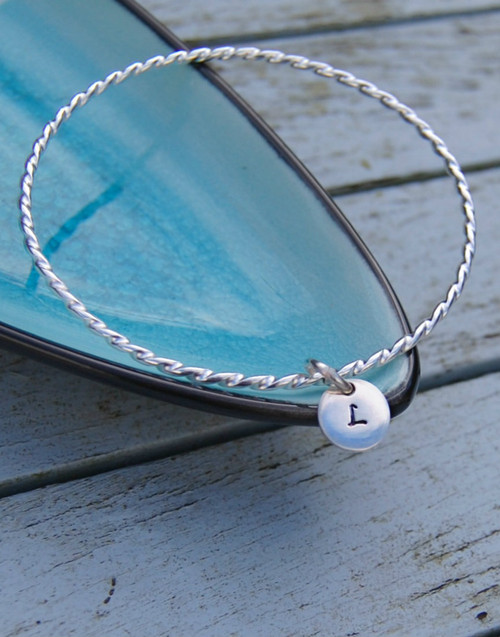 Chic twist bangle with initial charm Chic twist bangle with initial charm