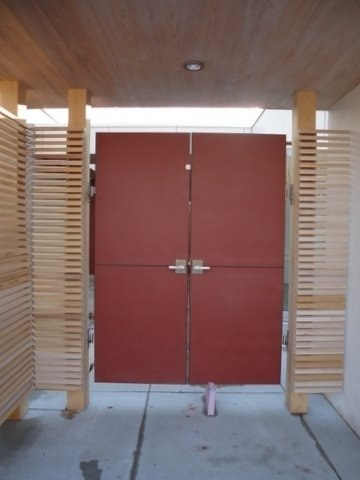 Contemporary Alta Stainless Steel Gate Latch on Double Wood Gate