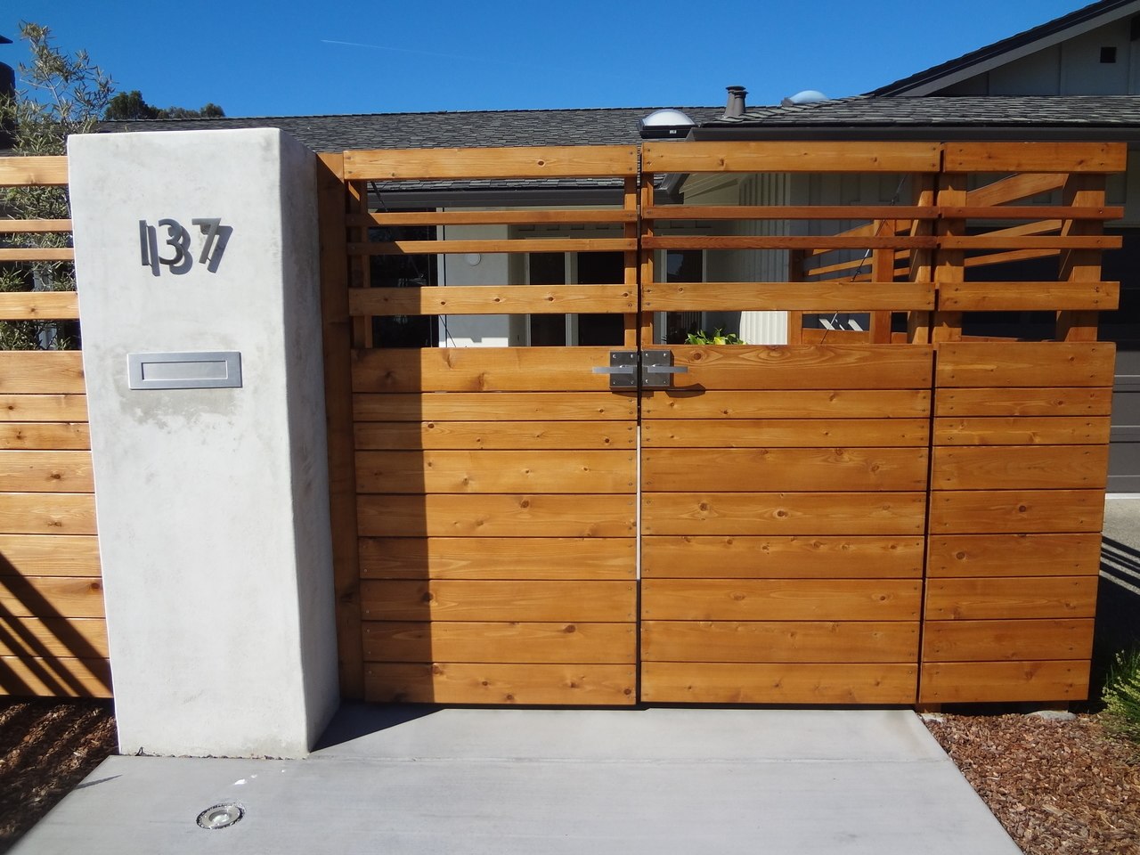 Contemporary Alta Stainless Steel Gate Latch on Modern Double Wooden Gate Front