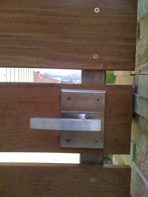 Modern Alta Stainless Steel Gate Latch on Wood Gate Closeup