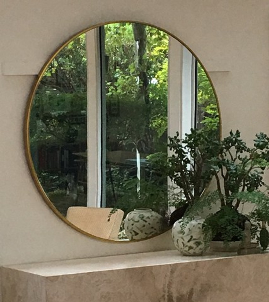 Modern round brass mirror
