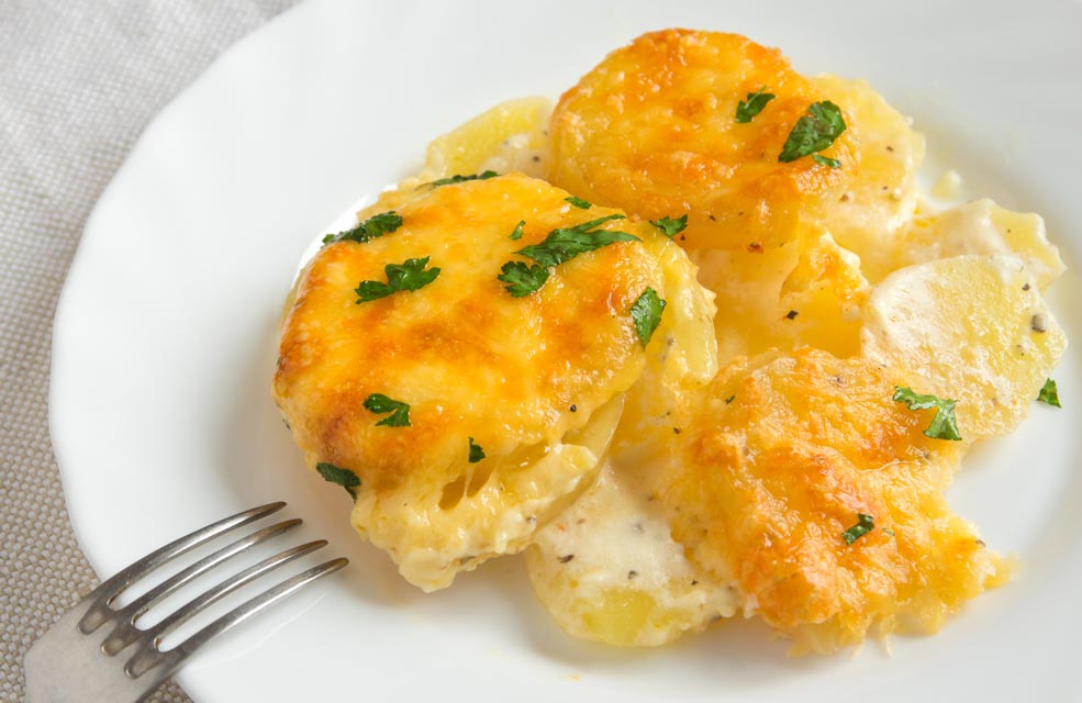 Modify a few ingredients to make a skinnier version of au gratin potatoes.