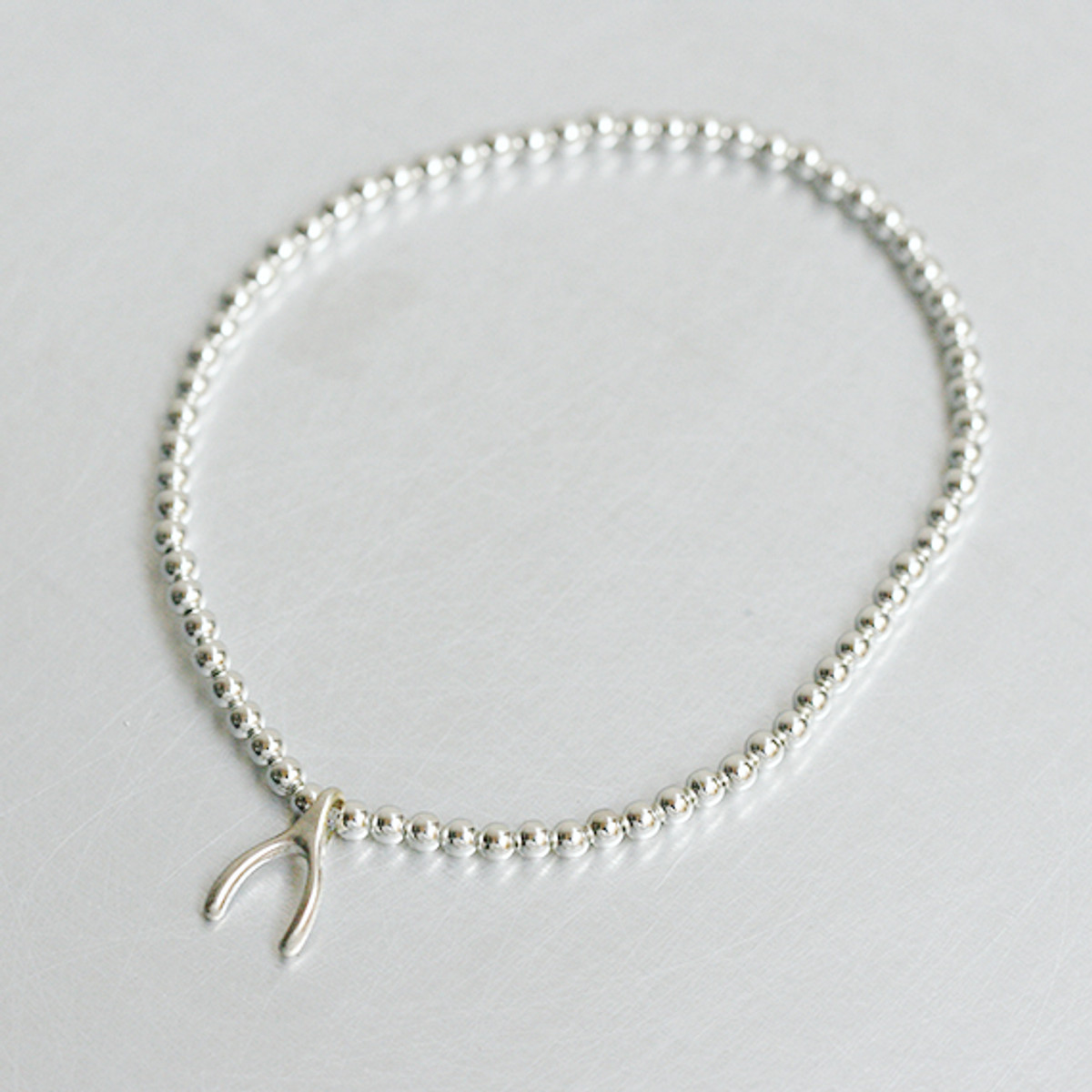 Wishbone Charm 2MM Silver Ball Bracelet