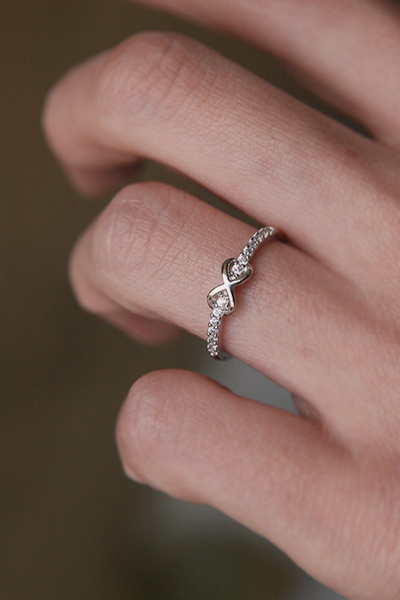 CZ Band Embraced Infinity Symbol Ring White Gold from kellinsilver.com