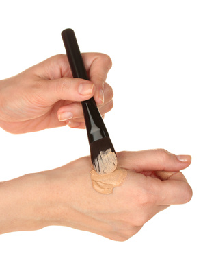 makeup-brush-mixing-loose-mineral-foundation-powder-moisturizer-back-of-hand.jpg