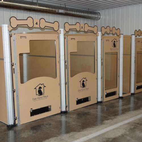 Large dog kennels with glass gates.