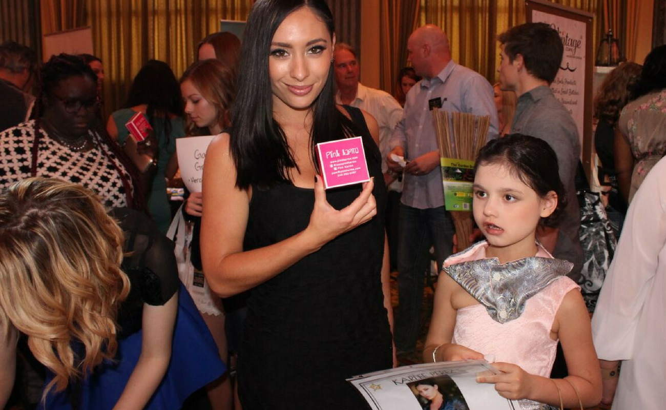 Karlee Perez, also known as Maxine from WWE, strikes a pose with her new Pink Karma exclusive Mermaid Necklace from The Oscars in 2016. Pink Karma debuted their new line at Celebrity Connected's Luxury Oscar Gifting Suite in 2016.