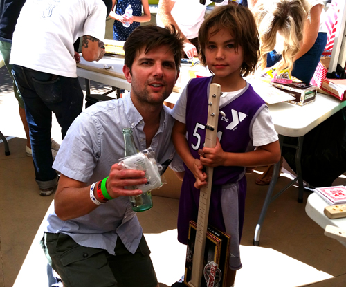 adam-scott-and-son-holding-a-pure-simple-cigar-box-guitar.jpg