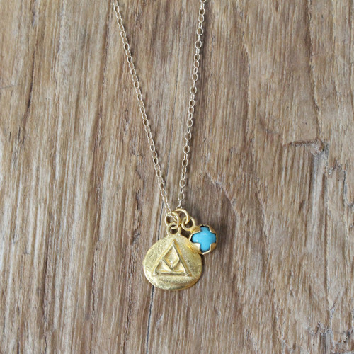 gold 'transition' charm necklace with turquoise stone detail