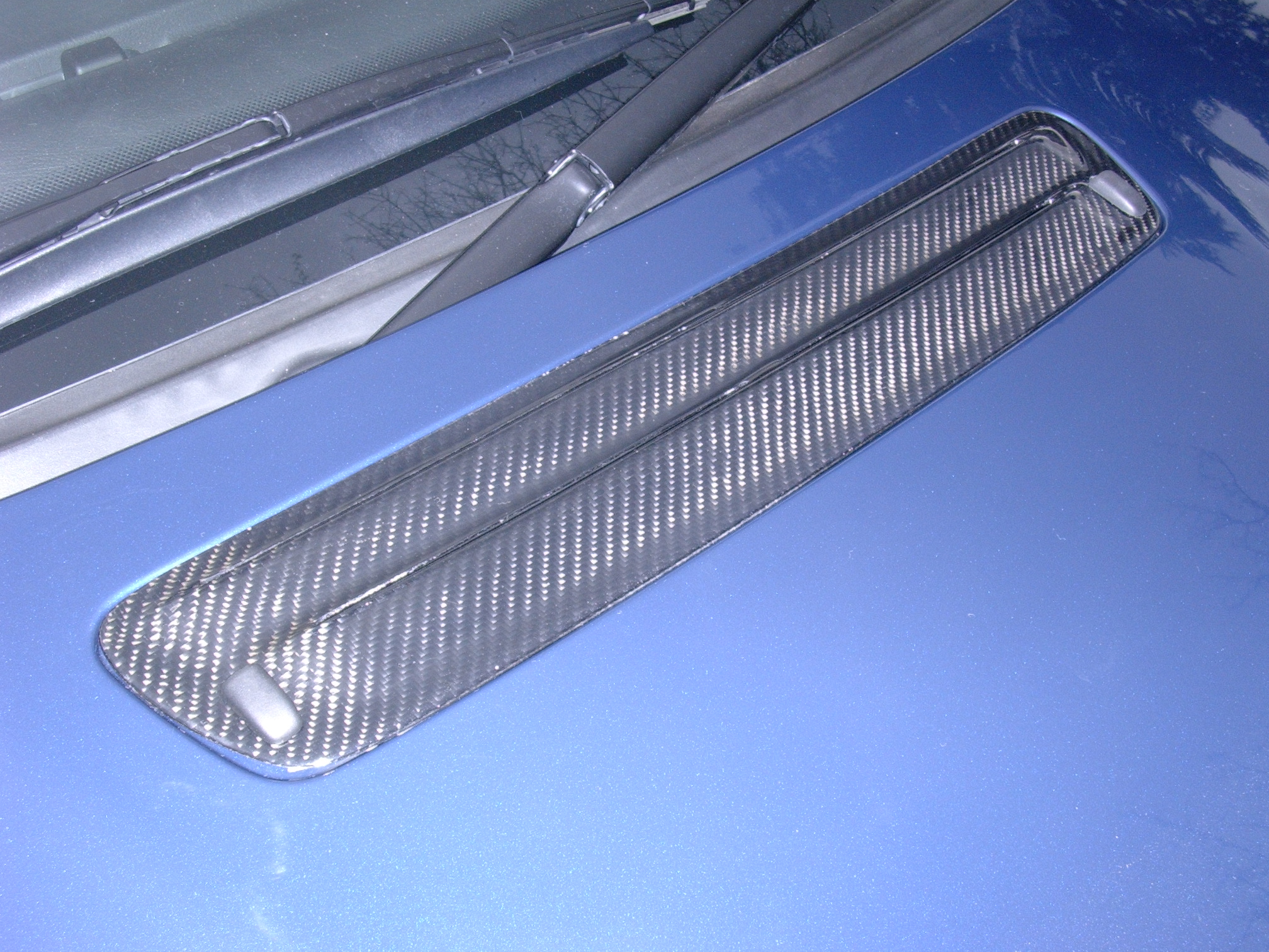 bmw-e46-m3-carbon-washer-jet-panel.jpg