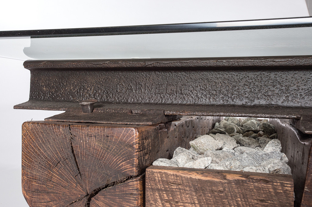 historic reclaimed iron artifacts from industrial age tycoons remade into tables and furniture