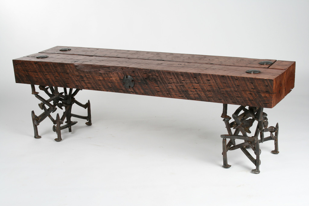 refined rustic bench with wood timber top and random iron legs from salvaged scrap metal