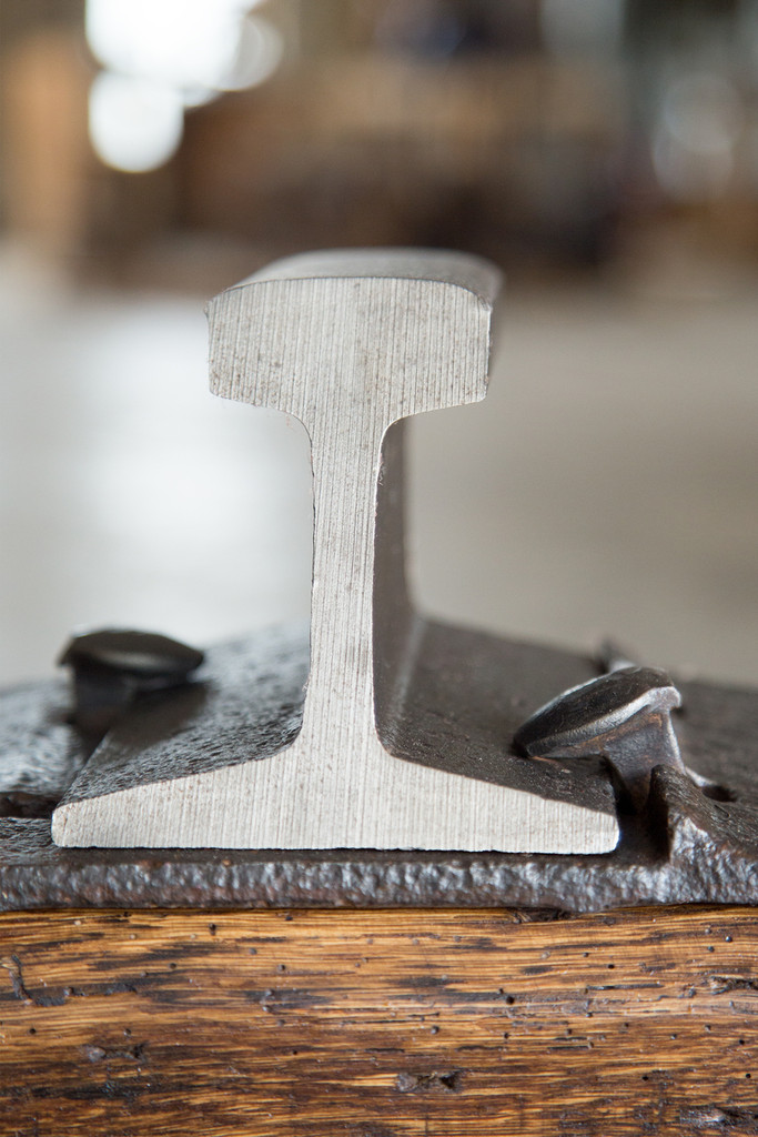 reclaimed steel accent detail on oak wood bench