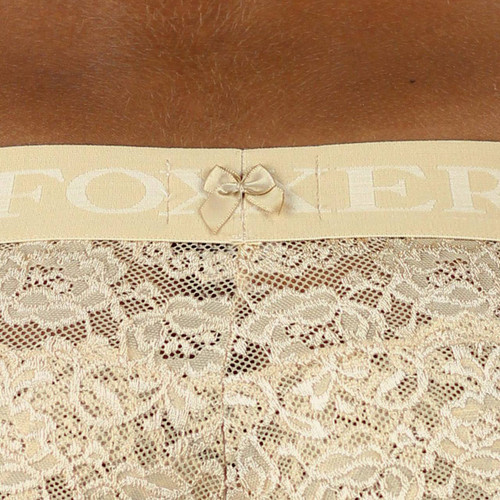 The back of our nude logo flat waistband is detailed with a small satin nude bow