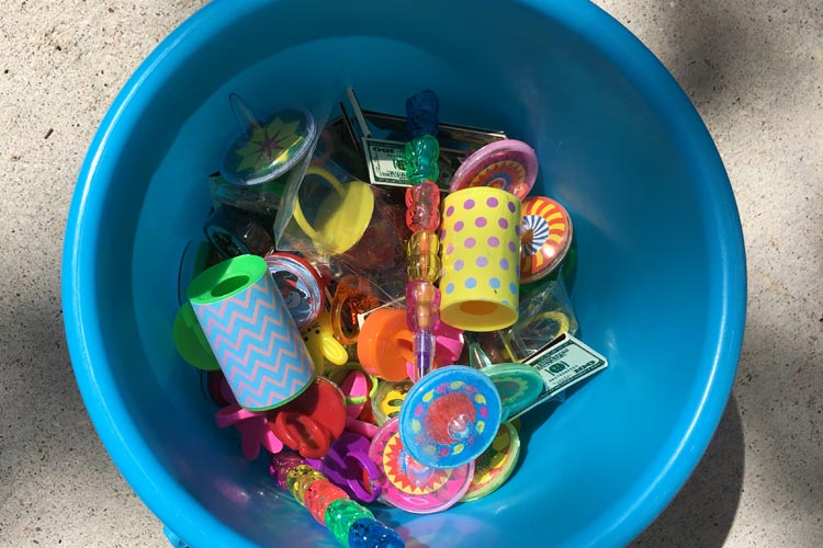 Blue bucket with inexpensive carnival prizes