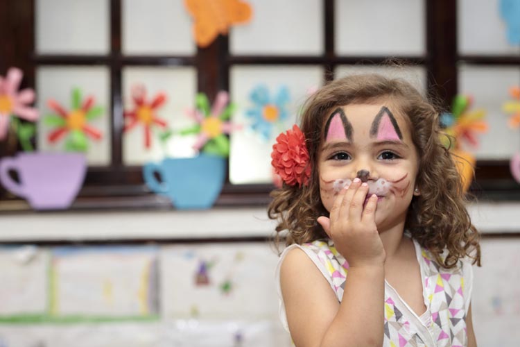 face-painted-girl-inside-school-at-carnival.jpg