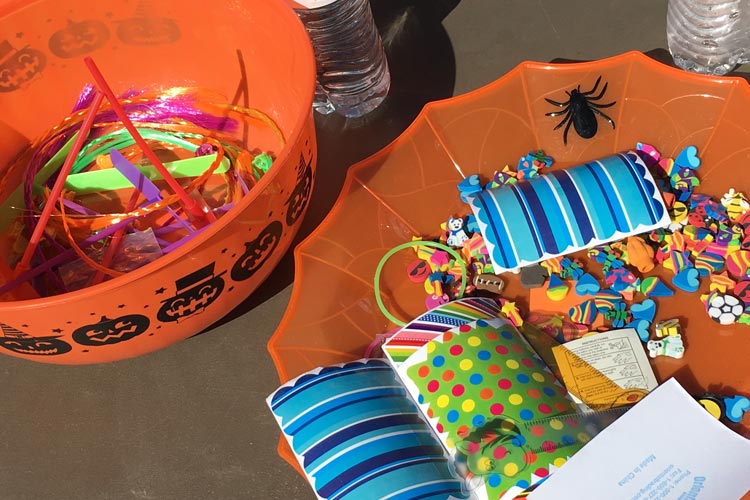 Small toys and fall carnival prizes in buckets