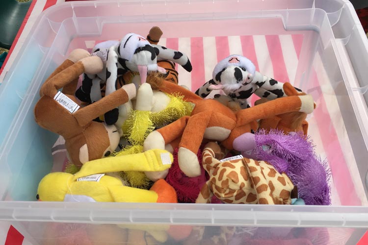 Disorganized stuffed animals or carnival plushes in a bucket are not super appealing to kids