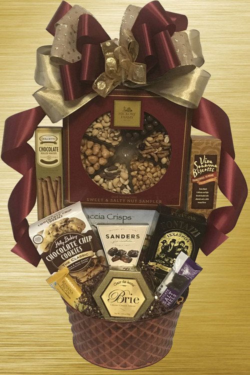 Designed in a beautiful bronze textured tin, this gift is brimming with delicious gourmet items, nuts and snacks! Includes a large gift boxed nut assortment (chocolate nuts, honey peanuts, roasted & salted whole cashews, roasted mixed nuts, cranberry sesame nut mix, and butter toffee peanuts), honey mustard pretzels, cookies, chocolates, cheese and crackers. A great gift for employees, a whole team to share, clients, host or hostess, friends and family. Makes an impromptu party!
Includes a free ribbon banner with a message of your choice! Message suggestions:
For an employee the banner could say "We're Nuts About You're Work!"
For a client the banner could say "We're Nuts About You're Business!"
For a personal thank you or birthday the banner could say "We're Nuts About You!"