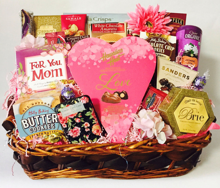 Mom will feel so special when this elegant tray, filled with gift items, gourmet goodies and confections, arrives on her special day! The tray includes a book for mom, designer floral credit card holder (can also be used for business cards) chocolate macadamia nuts in a heart shaped box, French butter cookies, chocolate chip cookies, a tin of tea, coffee, nut mix biscotti, Relaxation Mind And Body soak, and floral enhancements. If you would like to customize it, give us a call! Free ribbon banner can be added with any message of your choice. Great for Mother's Day, Birthday, and just because!