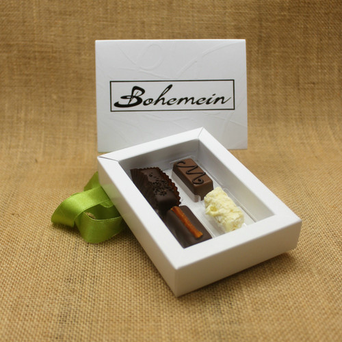 Overwhelmed by choice?
Let our knowledgeable Staff and Chocolatiers make the decisions for you.
Our recommended assortment is Cocoa Nib Caramel, Maple Cream, Rosemary and Apricot Ganache,Marc de Champagne Truffle.