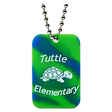 Custom silicone dog tag that is green and blue camo with the tuttle elementary school logo and turtle mascot.