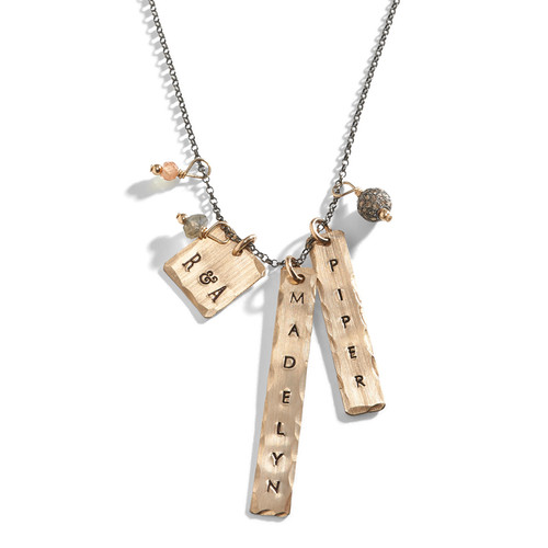 Aria Name Charm Tag Necklace offered in sterling silver chain with gold-filled rectangle charms. Aria Name Charm Tag Necklace offered in sterling silver chain with gold-filled rectangle charms.